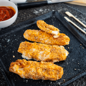 Serving of crispy yet gooey keto air-fried mozzarella sticks, a healthy low-carb snack